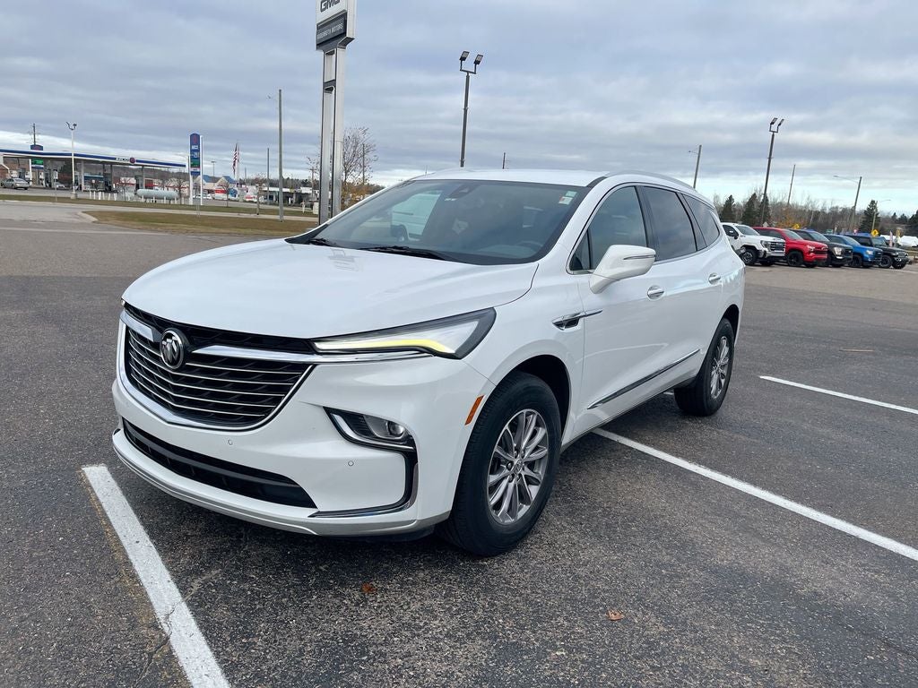 2023 Buick Enclave Essence in Summit White — front three-quarter view